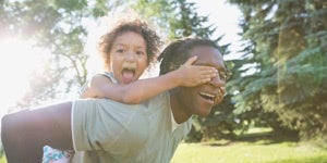 a man playing with a child